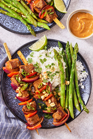 Sheet Pan Red Curry Ribeye Skewers with Coconut Rice, Charred Asparagus, and Sambal Peanut Sauce